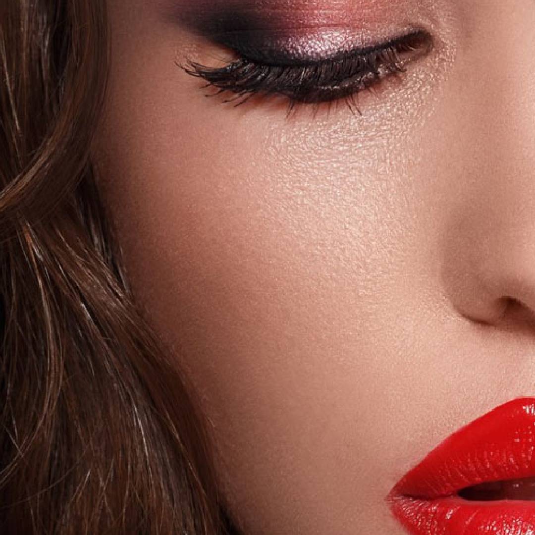 A close up of a woman with red lipstick