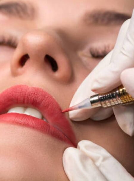 A woman getting an injected into her lips.